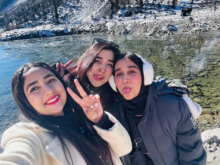 By the river